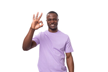 young african man of normal build dressed in a basic light lilac t-shirt with print mockup