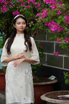 Young Vietnamese Female in Ao Dai Posing in front of the camera 