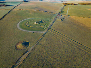 Aerial shot of Stonehenge, The Avenue and a burial mound, Wiltshire, UK