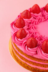 delicious strawberry cake on a pink background