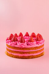 delicious strawberry cake on a pink background