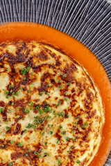 scramble with vegetables and herbs on a plate