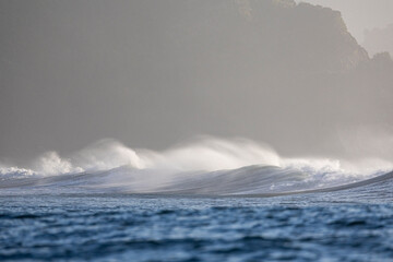 Waves breaking with the coast as a backdrop
