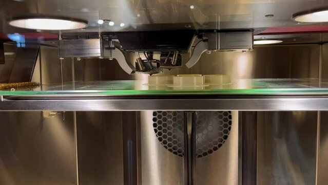 Industrial 3d printer printing a tool
