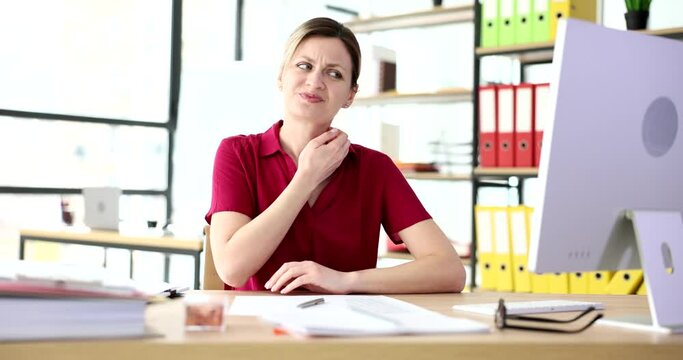 Businesswoman working at table in office and scratching her body skin 4k movie slow motion Neurosis and somatic manifestations of diseases concept