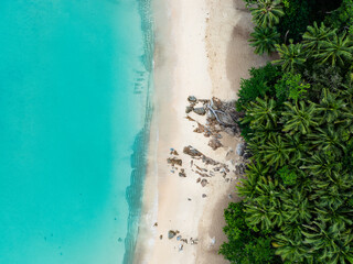 View from above, stunning aerial view of Banana beach, a beautiful white sand beach surrounded by...