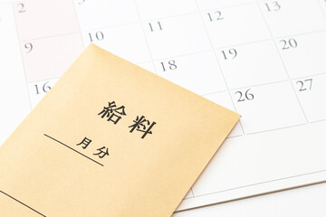 カレンダーと給料袋