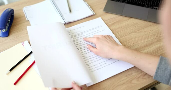 Actor leafing through script for play at table closeup 4k movie slow motion. How to get leading role in theater concept