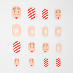 realistic set of colored false nails adhesive isolated on white background. top view. false nails...