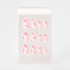 realistic set of colored false nails adhesive isolated on white background. top view. false nails...