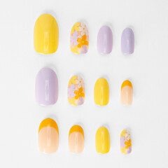 realistic set of colored false nails adhesive isolated on white background. top view. false nails acrylic nails for women. different fashion nail shapes.