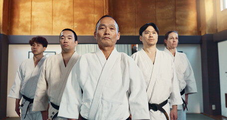 Japanese man, face and sensei in aikido for respect, honor and dignity with group in martial arts class. Portrait of male person or people in commitment for self defense, training or practice at gym - obrazy, fototapety, plakaty