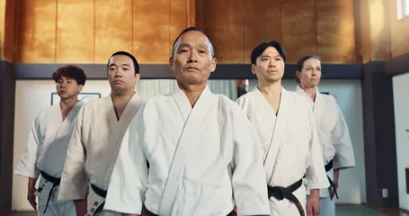 Foto auf Alu-Dibond Japanese man, face and sensei in aikido for respect, honor and dignity with group in martial arts class. Portrait of male person or people in commitment for self defense, training or practice at gym © N Felix/peopleimages.com