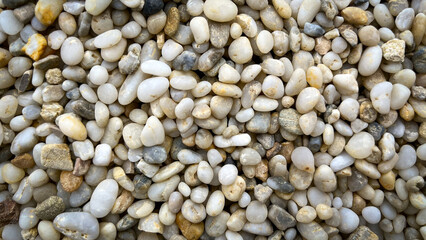 Small sandstone stones on seashore. Texture, Preset, Selective Focus