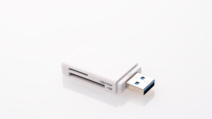 Flash card reader on white background Close-up, adapter SD to USB, microSD to USB