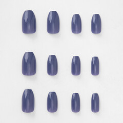 realistic set of colored false nails adhesive isolated on white background. top view. false nails acrylic nails for women. different fashion nail shapes.
