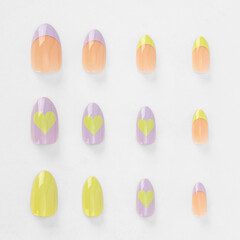 realistic set of colored false nails adhesive isolated on white background. top view. false nails acrylic nails for women. different fashion nail shapes.