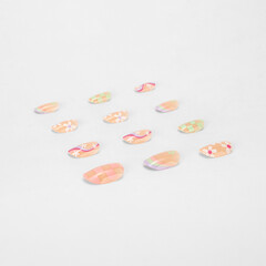 realistic set of colored false nails adhesive isolated on white background. top view. false nails acrylic nails for women. different fashion nail shapes.