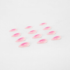 realistic set of colored false nails adhesive isolated on white background. top view. false nails acrylic nails for women. different fashion nail shapes.