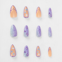 realistic set of colored false nails adhesive isolated on white background. top view. false nails...