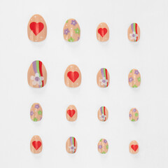 realistic set of colored false nails adhesive isolated on white background. top view. false nails...