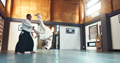 Aikido, fight and sensei master in martial arts with training of student in self defence or...