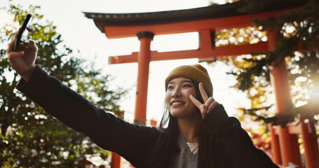 Selfie, nature and Japanese woman with peace sign for holiday, vacation and adventure in Japan....
