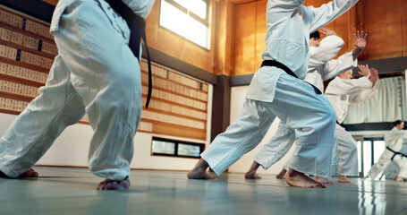 Students, Japanese people in aikido class for fitness and martial arts training class with self...