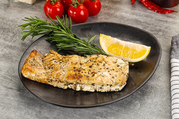 Baked salmon fish served rosemary