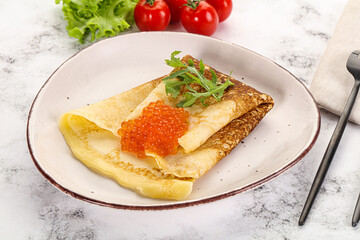 Russian pancake with red caviar