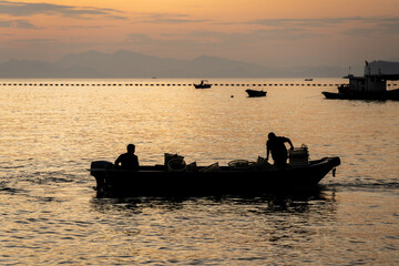fishing boat silhouette at sunset