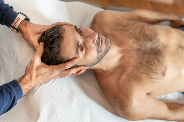 Fototapeta na wymiar Craniosacral Healing Therapy for Male Patient