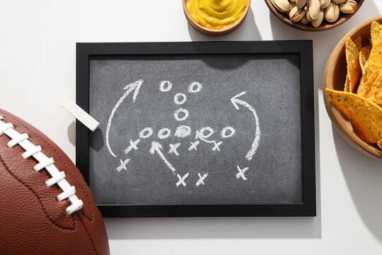 Black board with rugby ball and snacks - Powered by Adobe