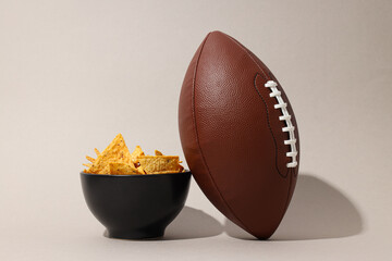 Chips with a rugby ball on a light background