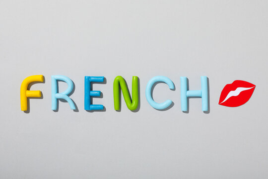 The word French on a gray background.