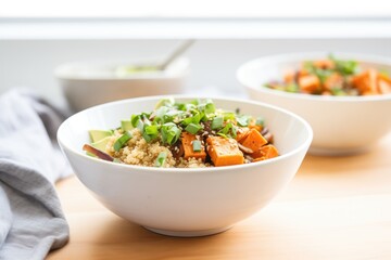 sweet potato and quinoa bowl with green onions