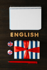 The concept of learning English, a notebook on a blue background.
