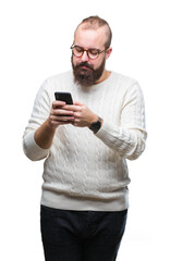Young caucasian hipster man texting sending message using smartphone over isolated background with a confident expression on smart face thinking serious