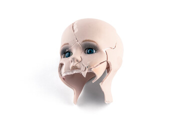 Broken vintage doll head isolated on white background with clipping path