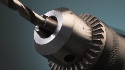 Demonstration of clamping in the chuck of a hand drill. Close-up, shallow dof.