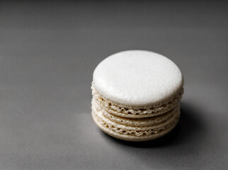 a macaron sitting on a monochrome background