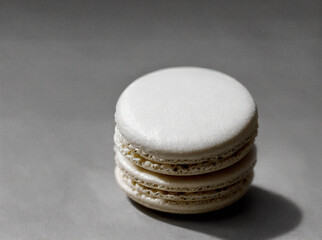 a macaron sitting on a monochrome background
