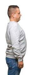 Middle age arab man wearing sport sweatshirt over isolated background looking to side, relax profile pose with natural face with confident smile.