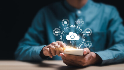 Cloud ERP, Enterprise Resource Planning concept. Businessman connecting data with cloud computing...