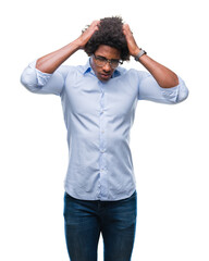 Afro american business man wearing glasses over isolated background suffering from headache desperate and stressed because pain and migraine. Hands on head.
