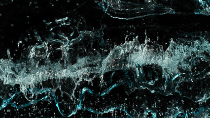 Close-up of splashing water surface on black background