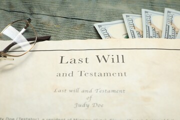 Last Will and Testament, glasses and dollar bills on rustic wooden table, closeup