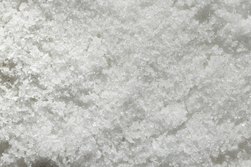 White coconut body scrub with bits of glitter shimmer background texture