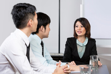 Chinese Business team having a meeting.