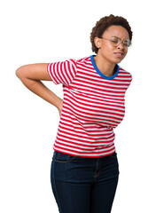Fototapeta premium Beautiful young african american woman wearing glasses over isolated background Suffering of backache, touching back with hand, muscular pain